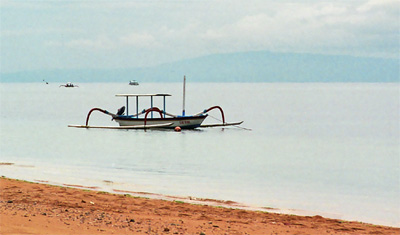 Typical Balinesean boat by the beach in sanur, bali