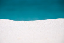 Sand och hav vid Grand Anse, La Digue Seychellerna